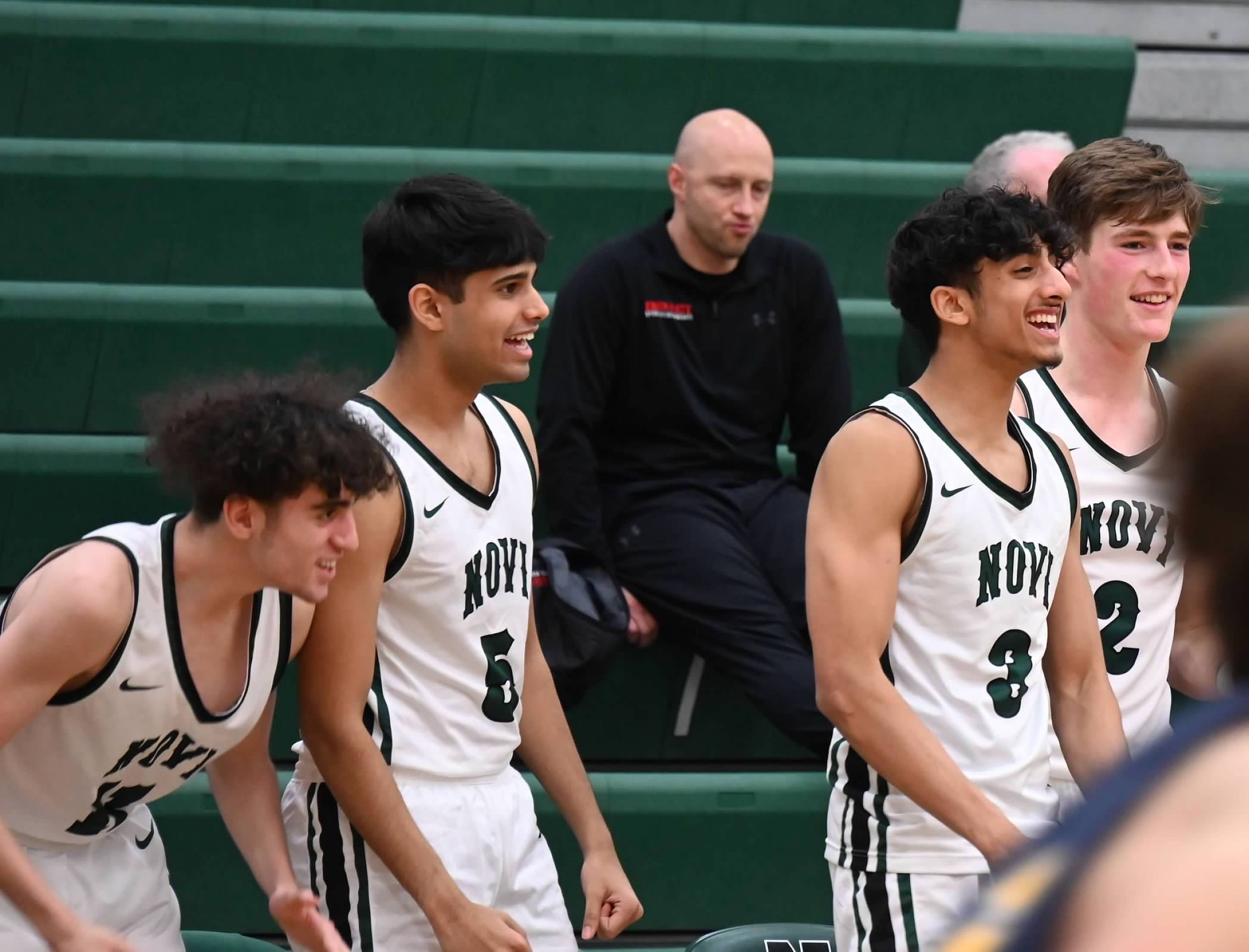 Sahil with the Novi varsity basketball team